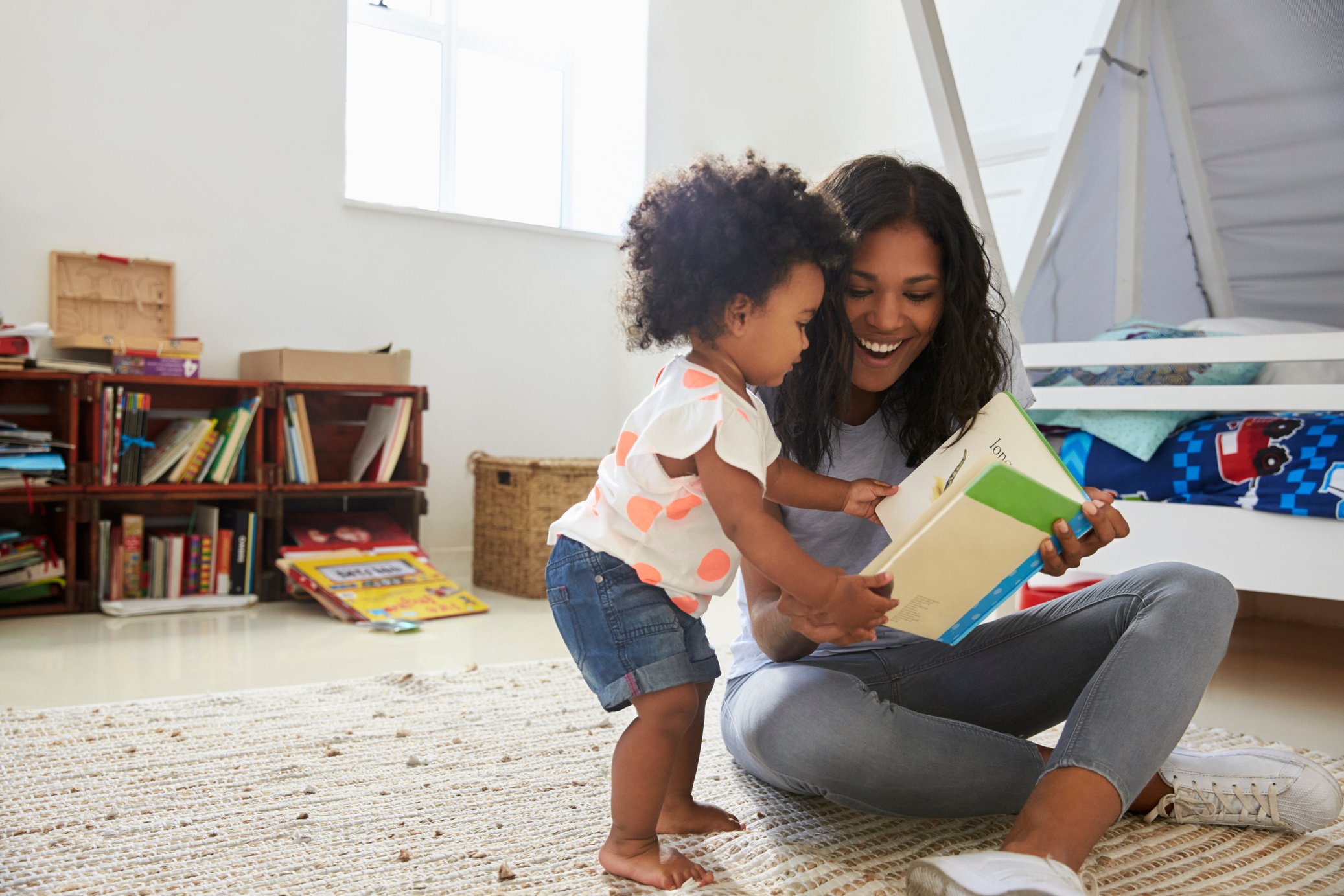 Mother and Baby Daughter Reading Book